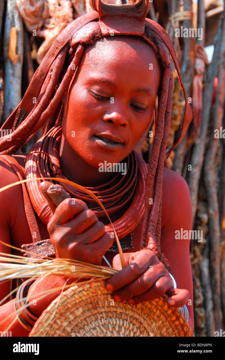Himba woman making a bast mat, handicrafts, Purros, Kaokoveld, Namibia, Africa Stock Photo