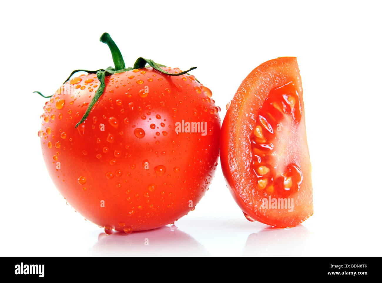 Perfect tomato covered waterdrops. Isolated Stock Photo