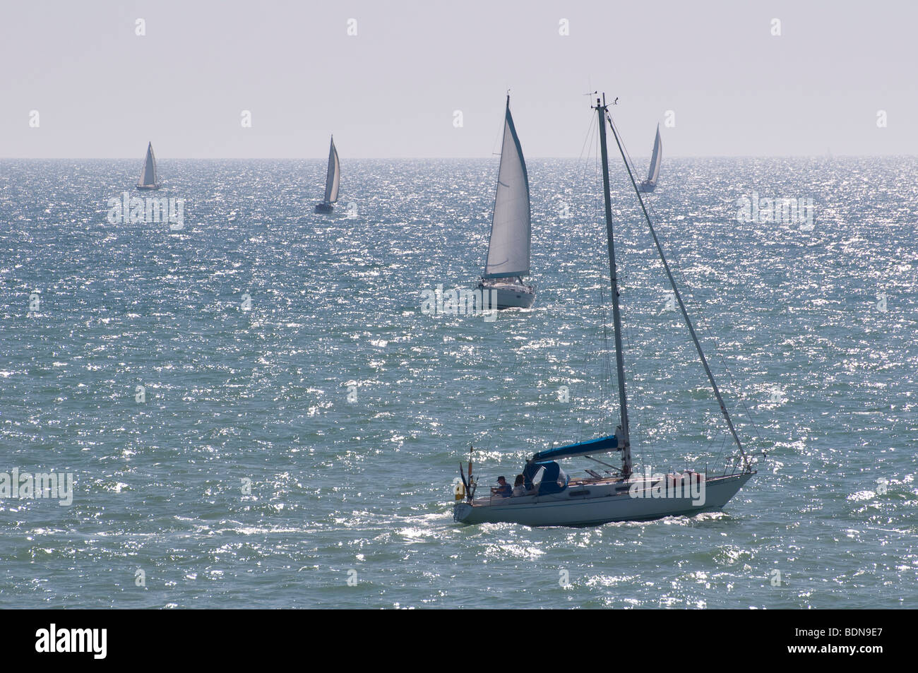 Sailing yachts in the sea by Brighton Marina in East Sussex, England. Stock Photo