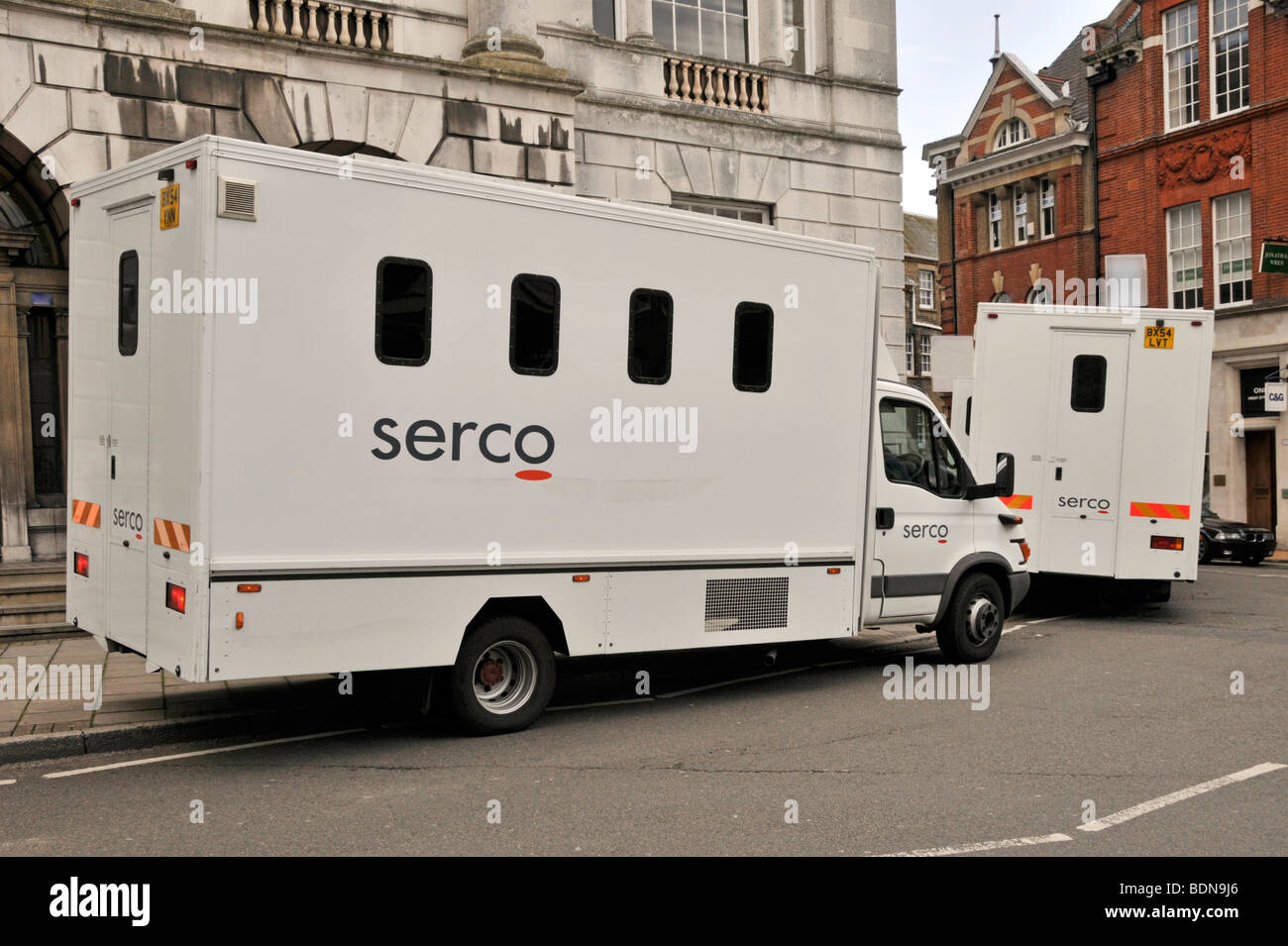 Serco prison vans parked on pavement outside Chelmsford Shire Hall used as Magistrates Court Essex England UK Stock Photo