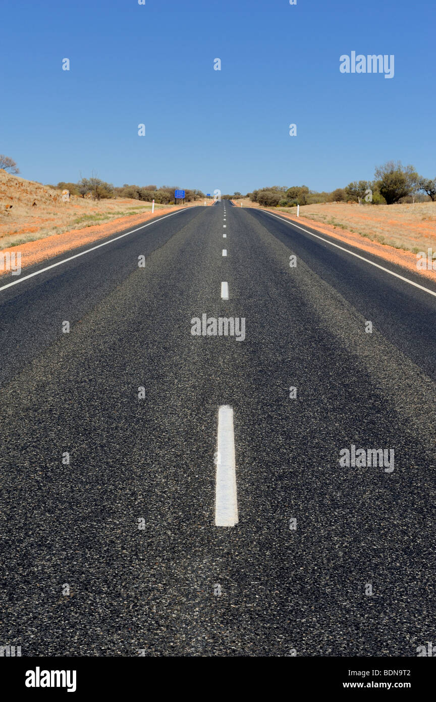 The Stuart Highway, a long, straight road in the Australian Outback. Stock Photo