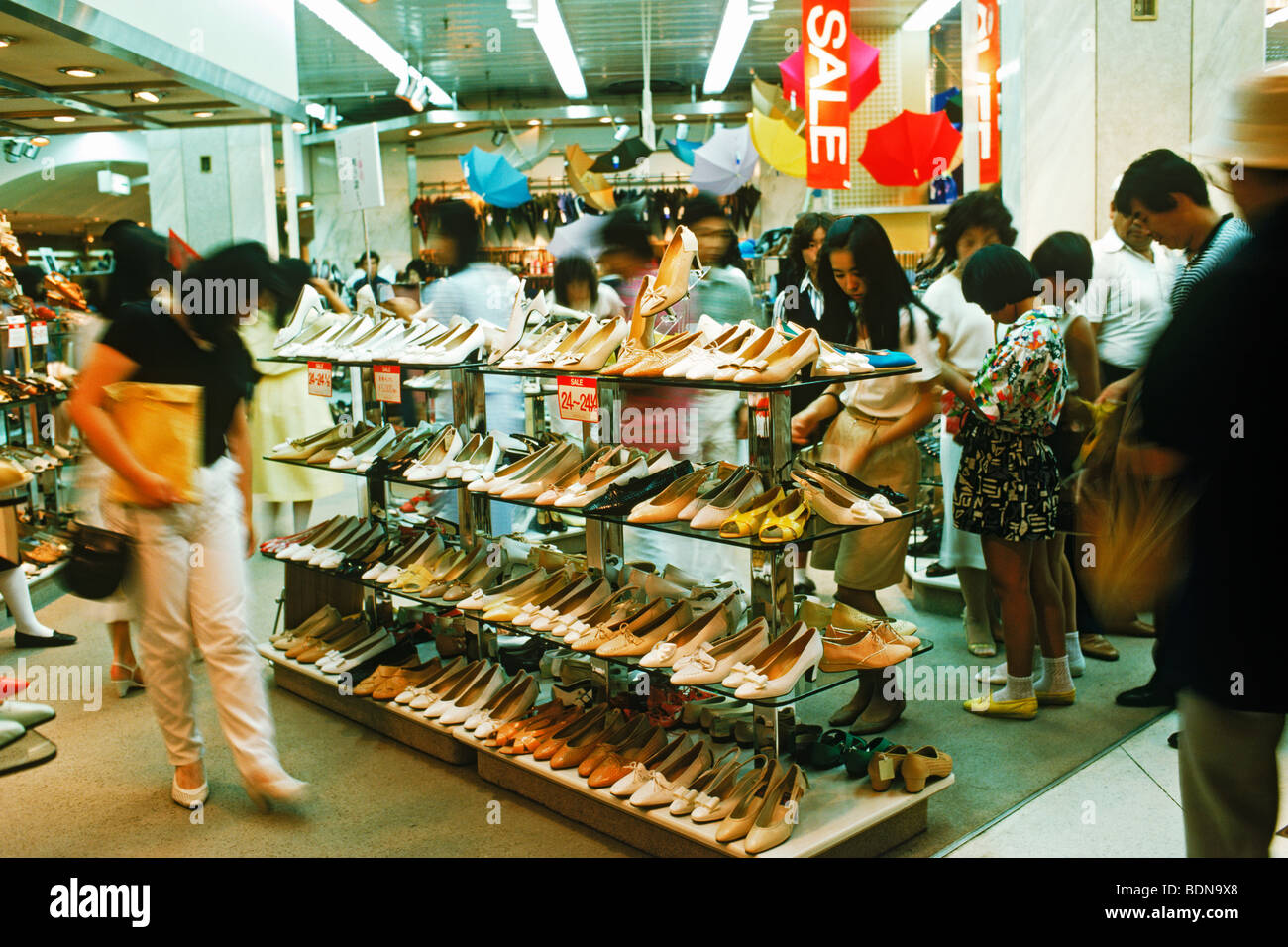 Men and women in shoe store at shopping mall in Tokyo Stock Photo Alamy