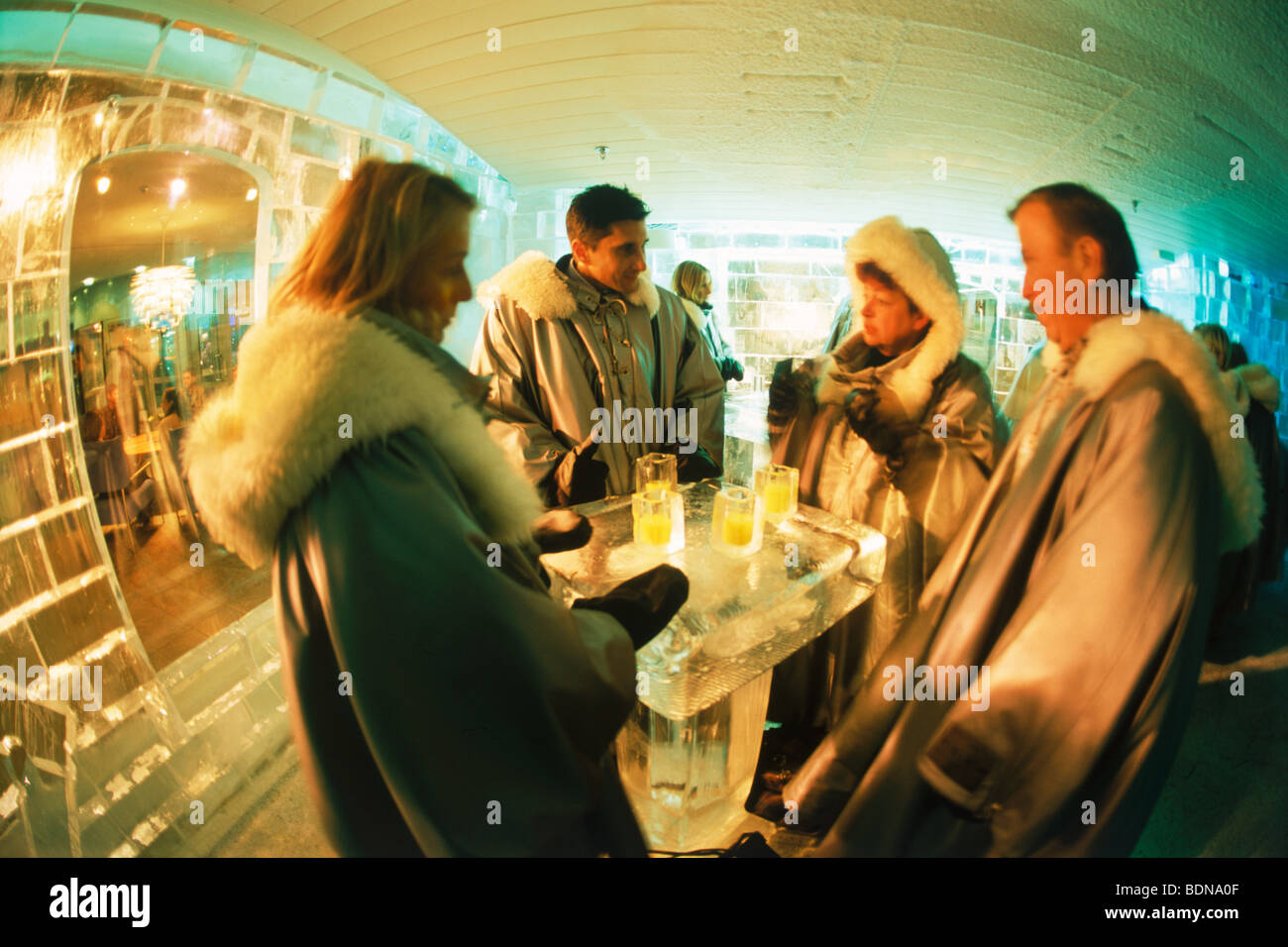 Tourists drinking frosty cocktails at Ice Bar in Nordic Sea Hotel in Stockholm Stock Photo
