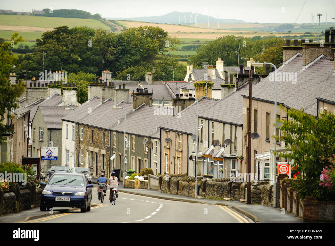 The village of Llanerch y Medd, Anglesey, north wales UK with windfarms in the distance Stock Photo