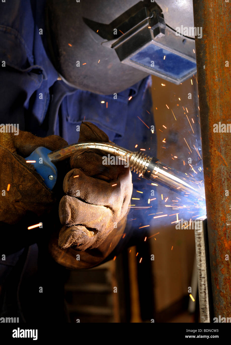 Welder welding heavy metal Stock Photo