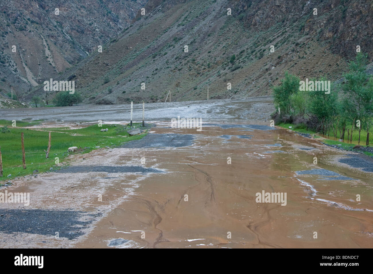 Mudslide covering the road in rural Kyrgyzstan Stock Photo