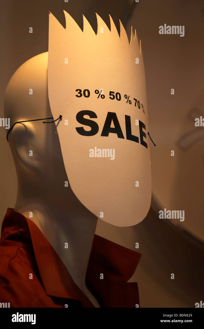 Window dummy, poster covering her face, advertising for sale Stock Photo