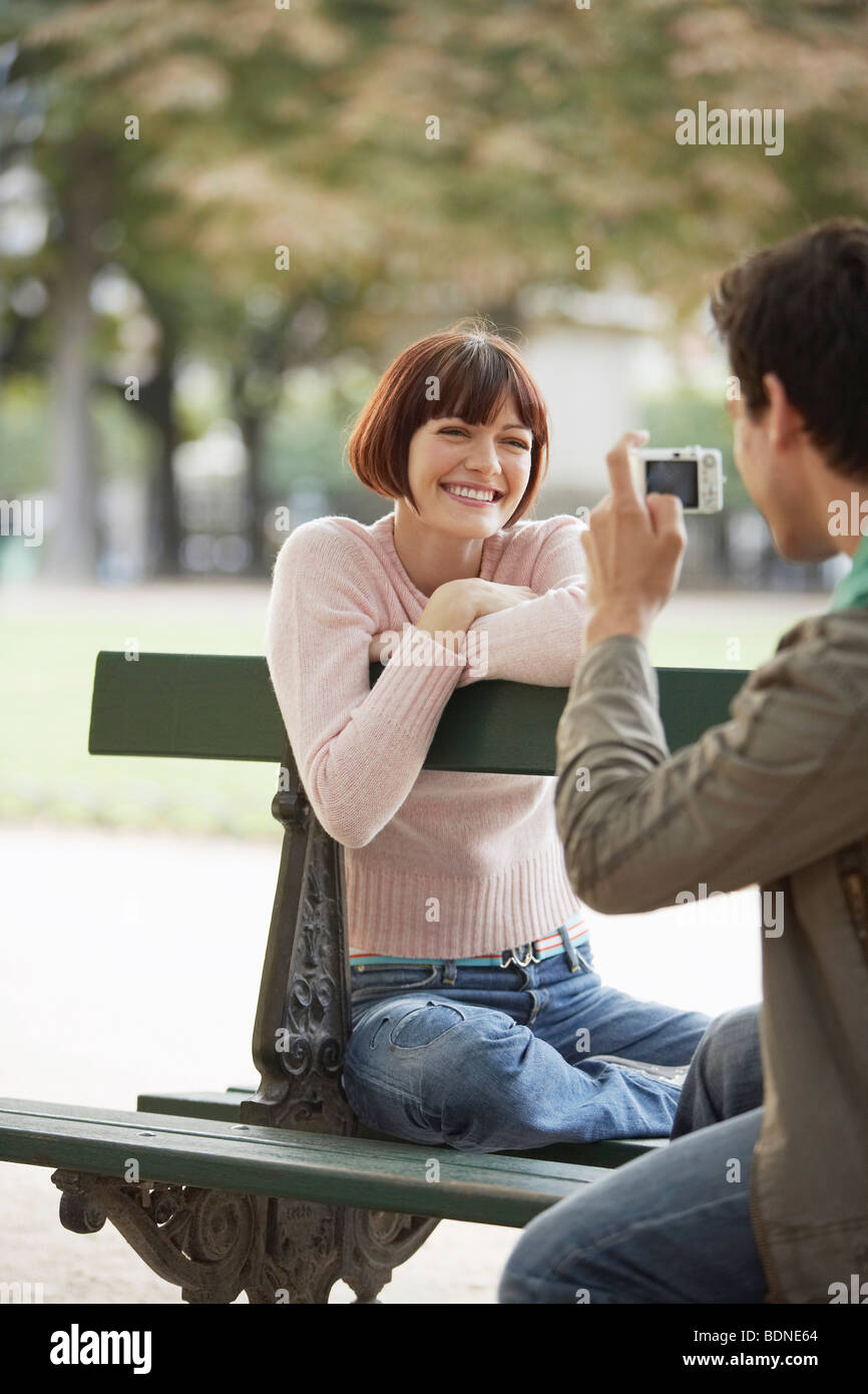 Couple Using Digital Camera in Park Stock Photo