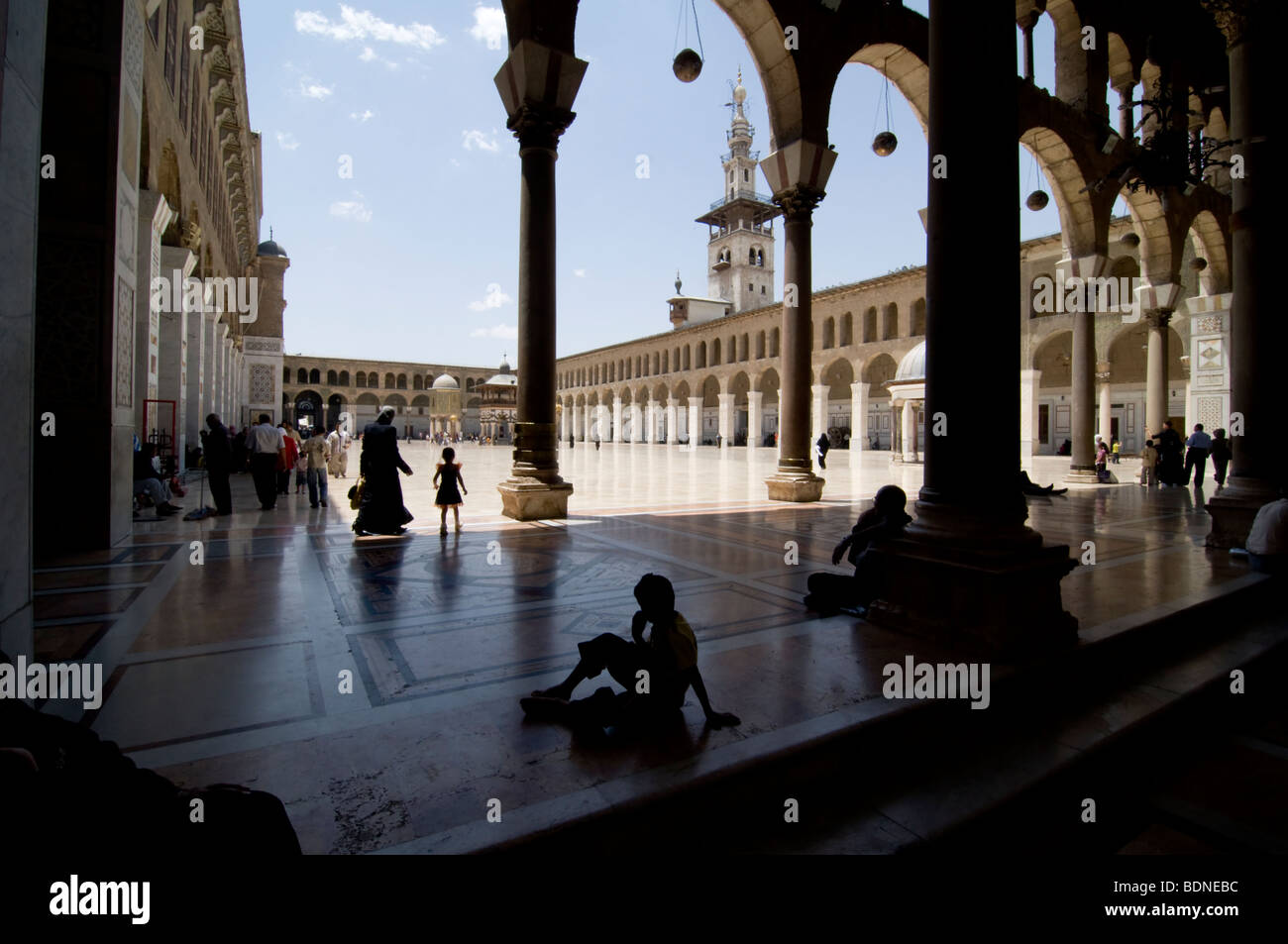 Children and families in the courtyard of the Umayyad Mosque (Grand Mosque of Damascus). Stock Photo