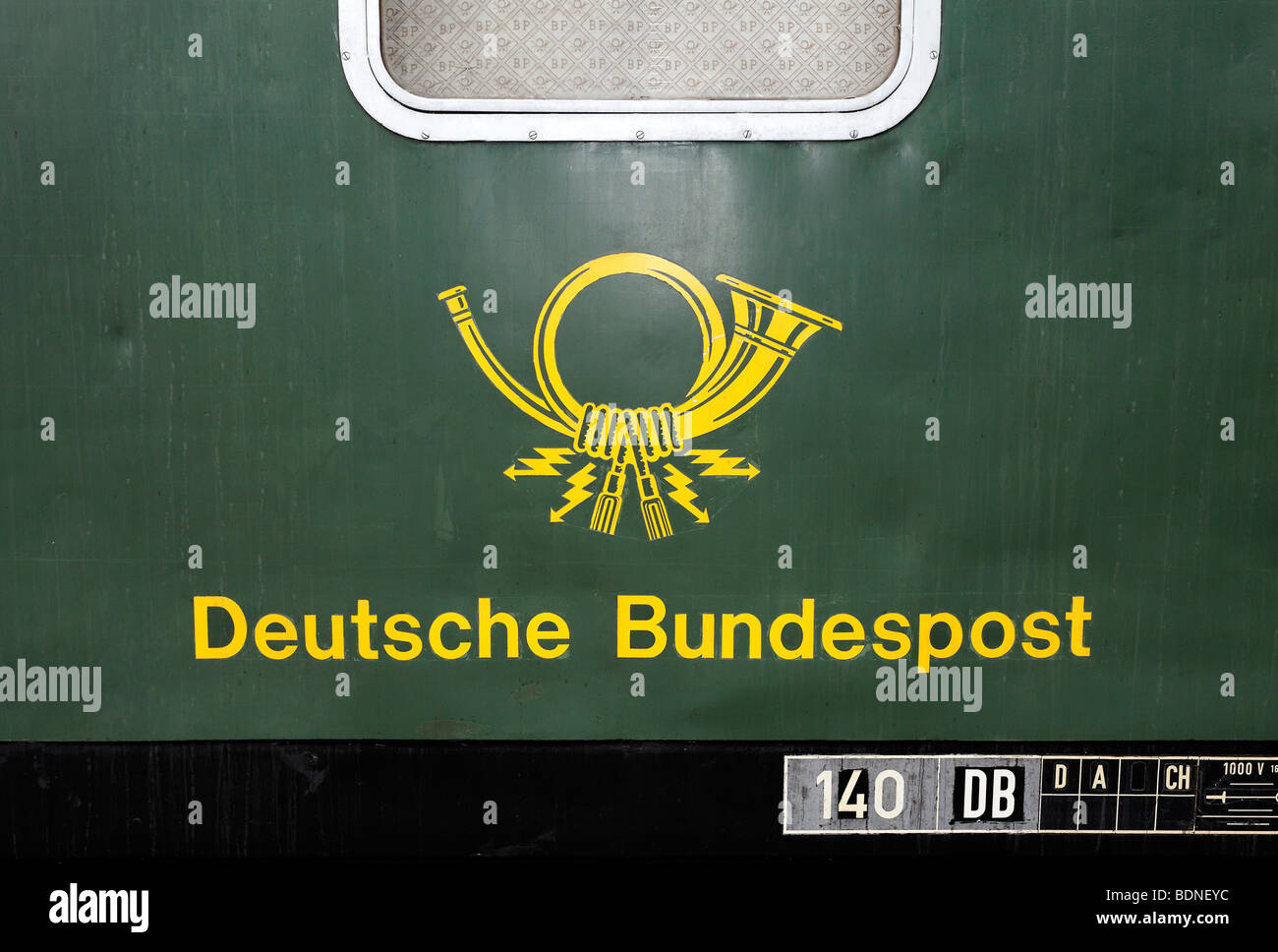 Historic wagon of the German Federal Mail with old post horn logo, circa 1960, Germany Stock Photo