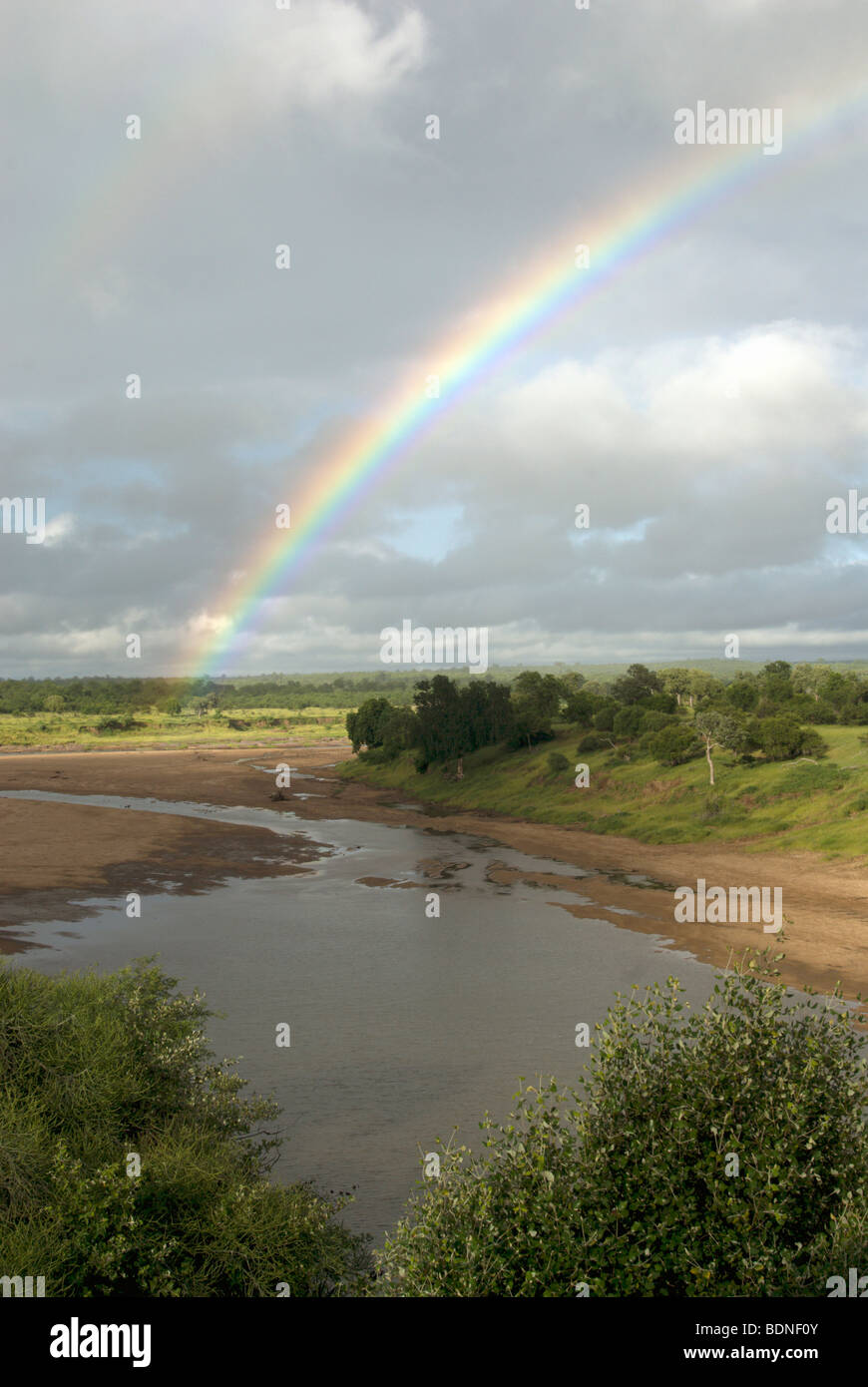 Rainbow above Makonde Pools, Mwenezi River, Gonarezhou National Park, Zimbabwe Stock Photo