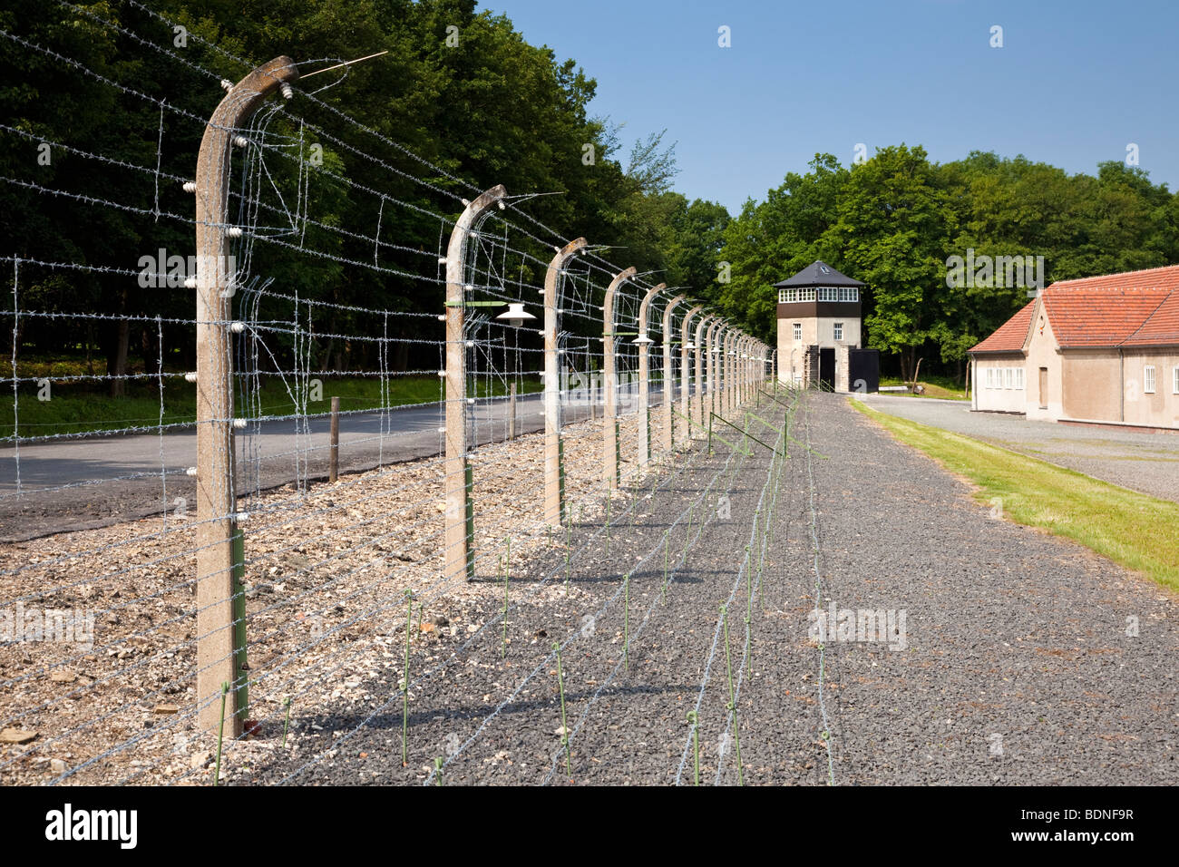 Barbed wire fence and guard tower at the Buchenwald Nazi Concentration Camp, Ettersberg, Germany, Europe Stock Photo