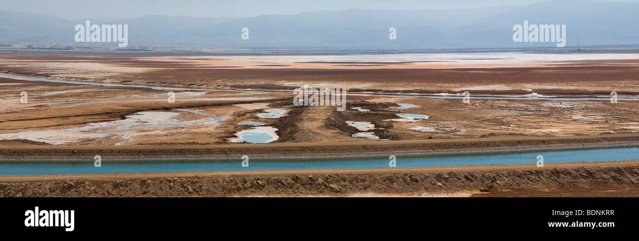 Evaporation ponds operated by 'Dead Sea Works' potash plant which commercially extract minerals from evaporation pools in the southern Dead Sea Israel Stock Photo