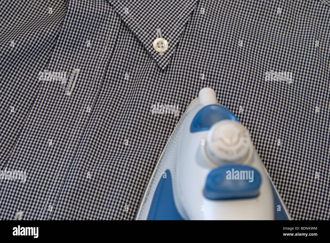 ironing a shirt Stock Photo Alamy