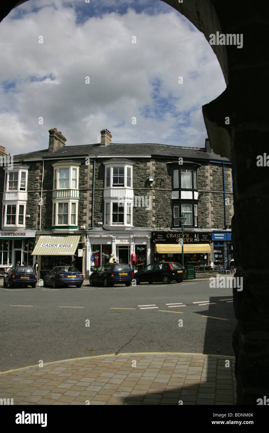 The town of Dolgellau, Wales. Town centre shops viewed through the arches of Neuadd Idris, the