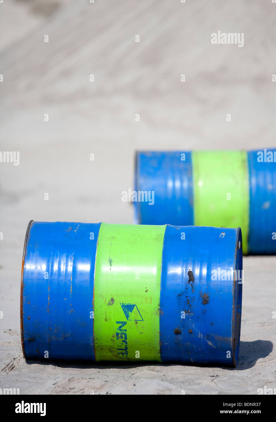 Lubricant oil barrels on sand Stock Photo Alamy