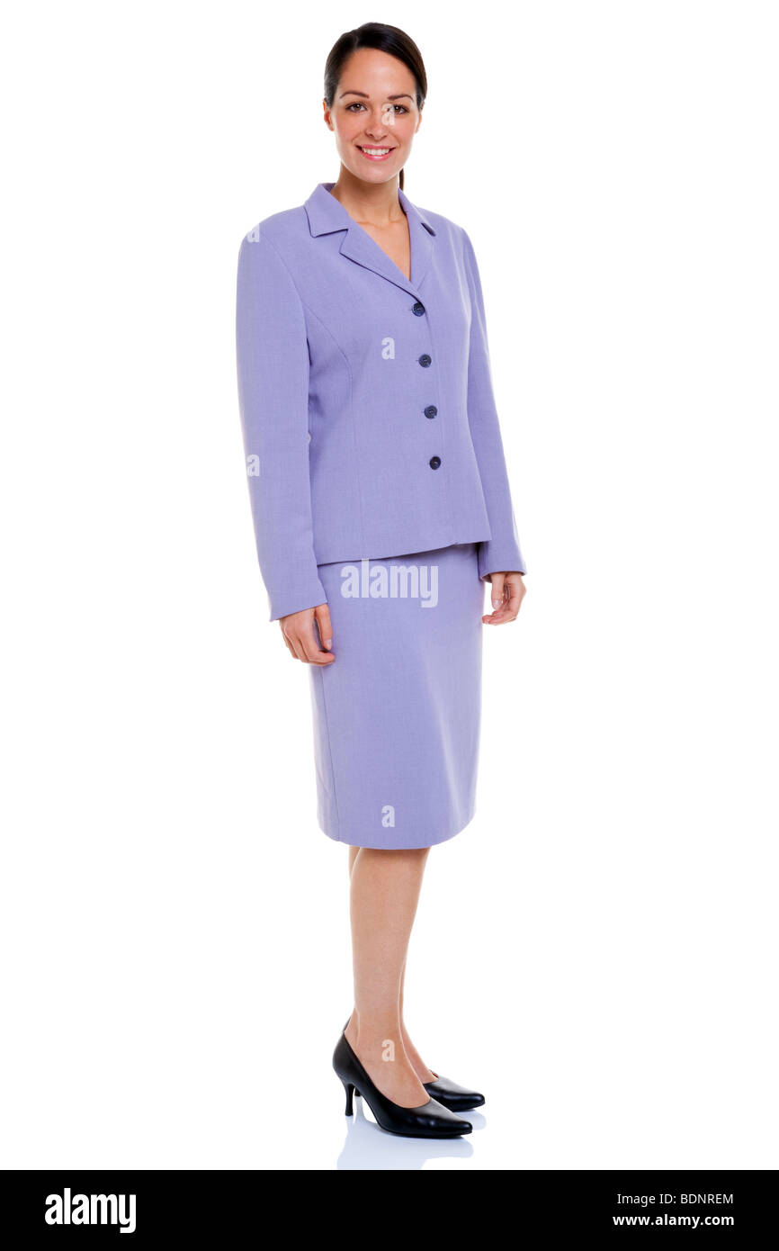 Attractive businesswoman wearing a lilac coloured skirt suit, isolated on a white background. Stock Photo