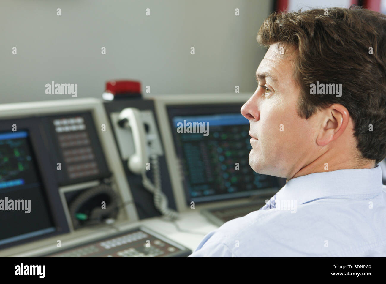 Operating engineer in a control room Stock Photo Alamy