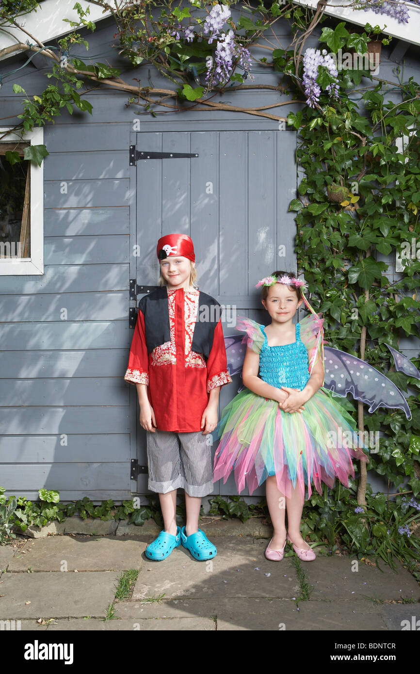 Portrait of young boy (7-9) in pirate costume, girl (5-6) in fairy costume  by shed Stock Photo - Alamy