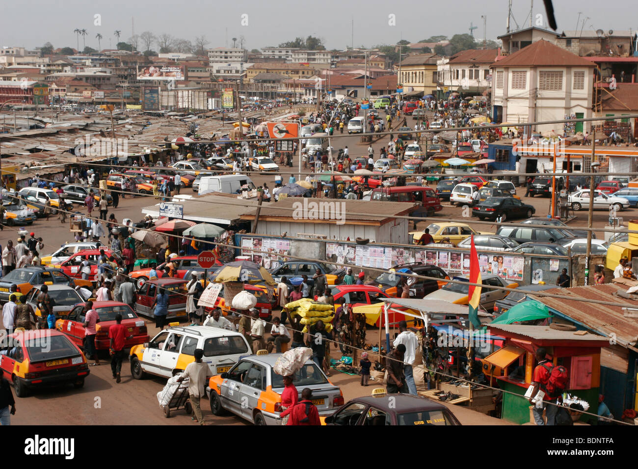 Traffic passing the very busy Kejetia Market in central Kumasi. Ghana. West Africa. ©Picture Zute Lightfoot. 07939 108077. Stock Photo