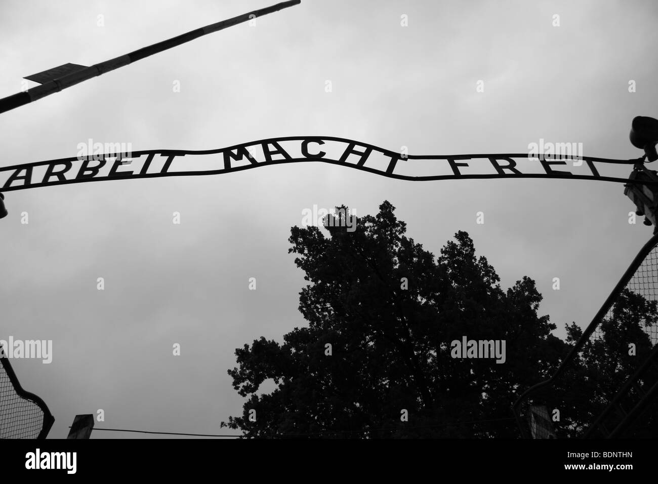 The 'Arbeit Macht Frei' or 'work brings freedom' sign above the entrance gate to the Auschwitz death camp, Oswiecim, Poland. Stock Photo