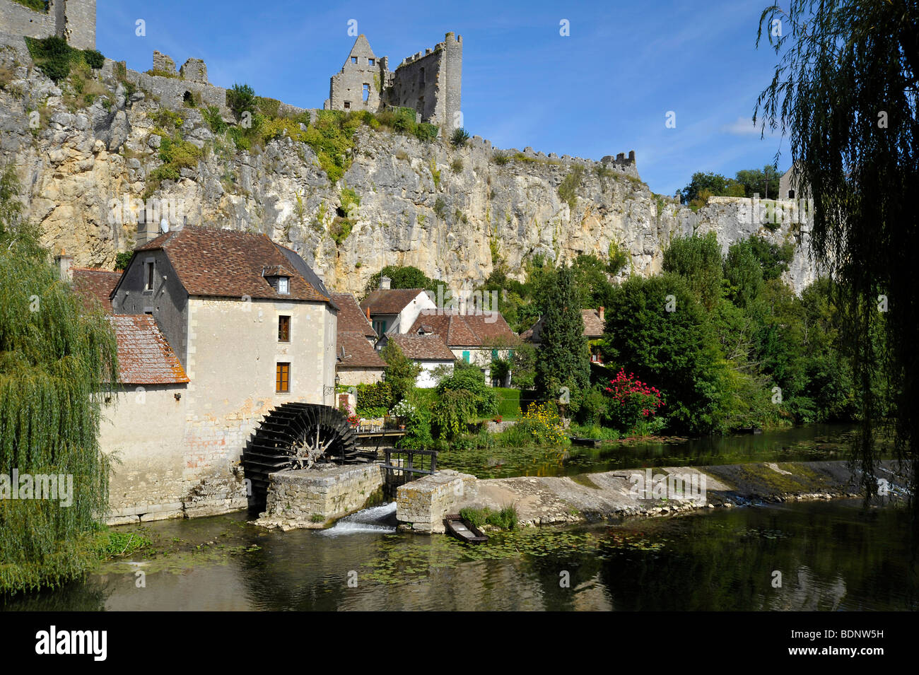 Tranquil river scene and watermill in the town of Angles sur l' Anglin, France Stock Photo