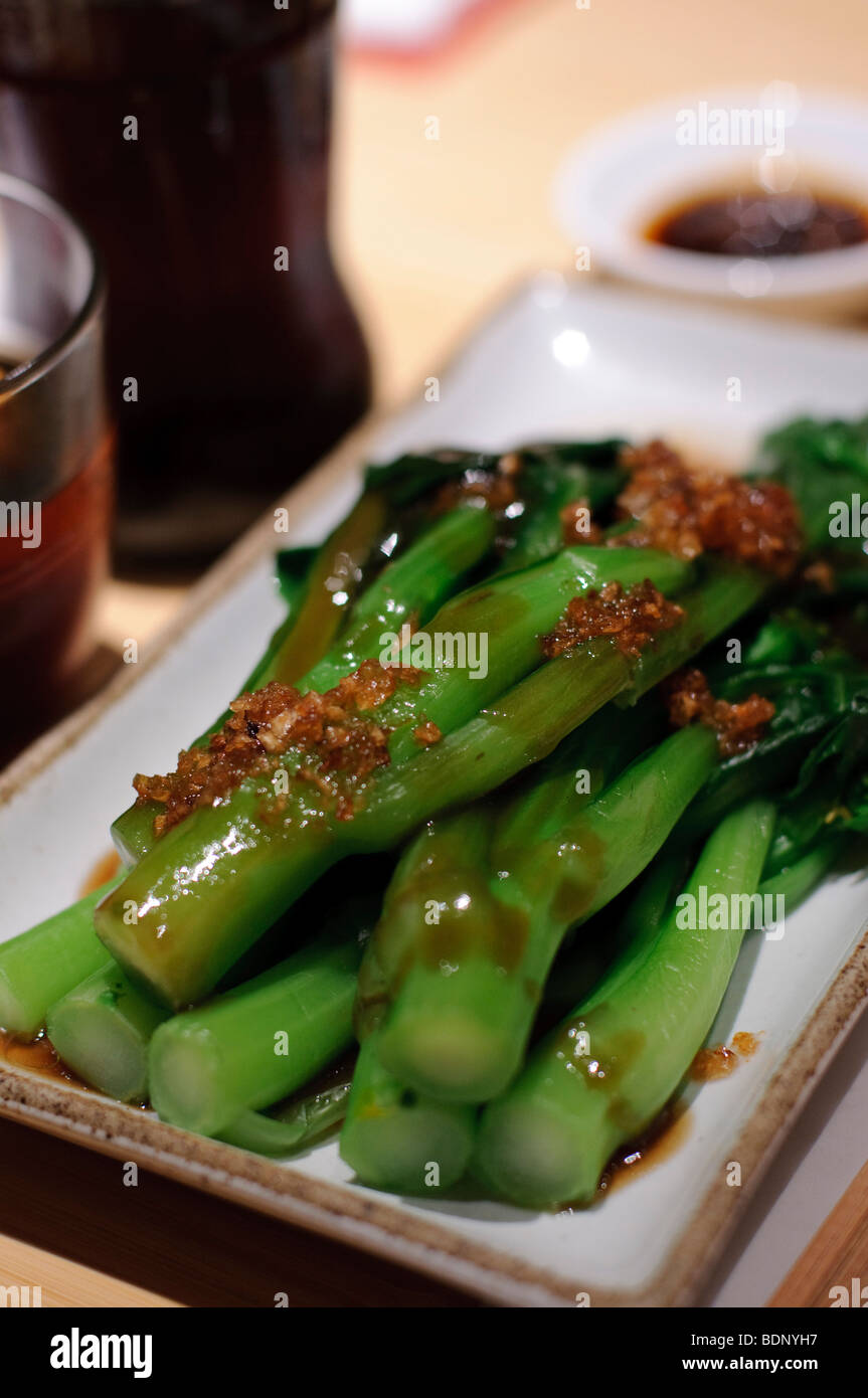 Choi sum served with garlic Stock Photo