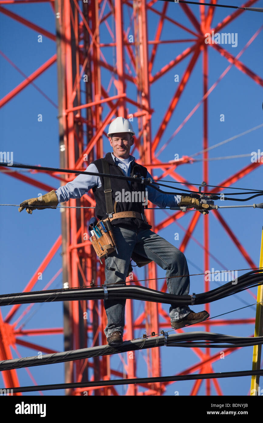 Cable lineman repairing transmission line Stock Photo Alamy