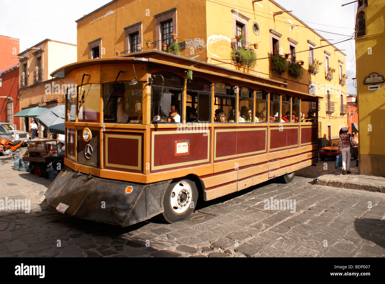 Sightseeing trolley bus on a street in San Miguel de Allende, Guanajuato Mexico Stock Photo