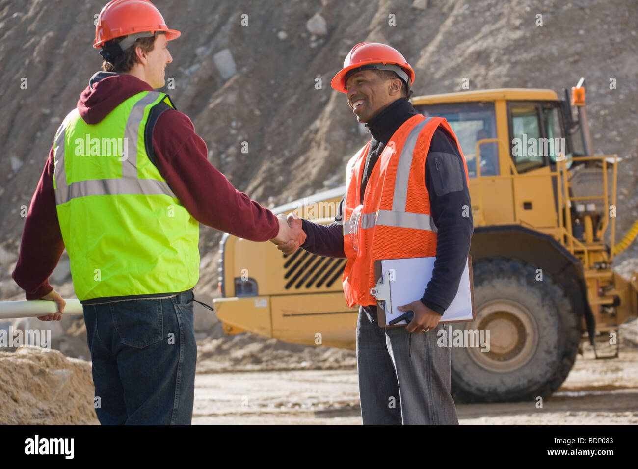 Two engineers shaking hands Stock Photo