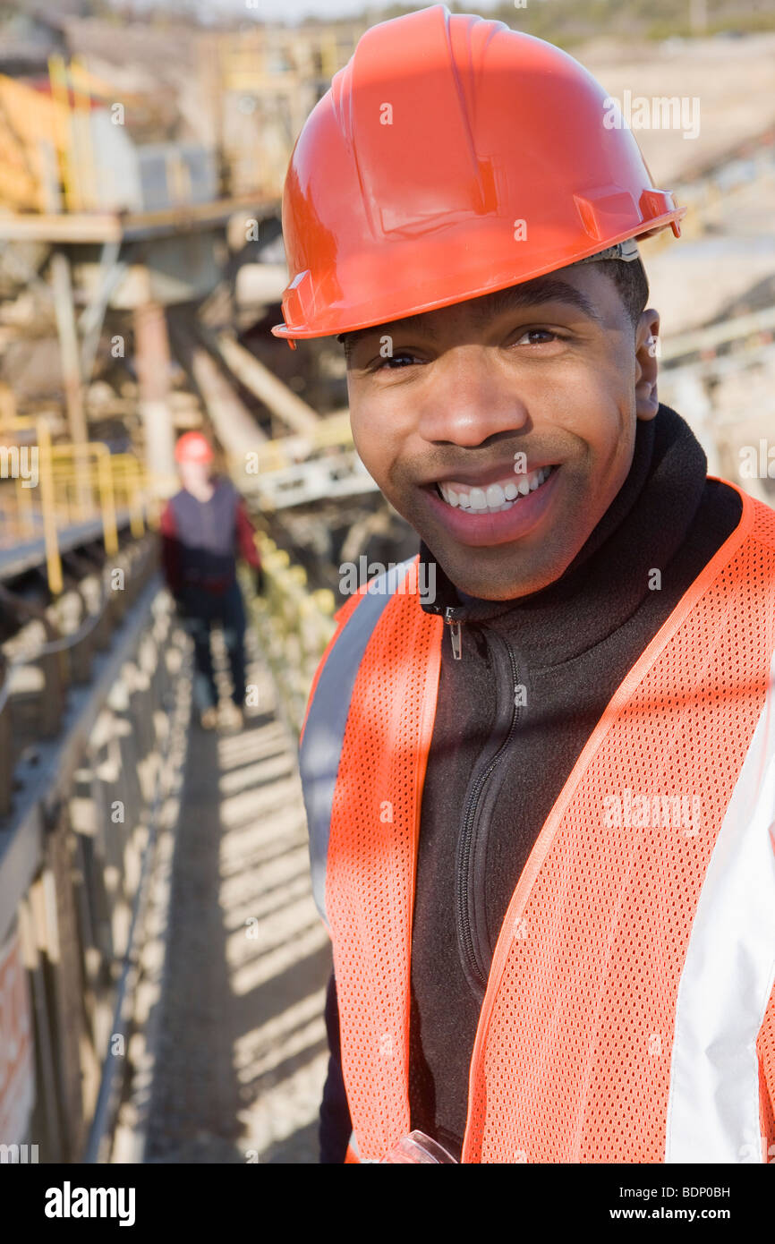Engineer on a conveyor belt at a construction site Stock Photo Alamy