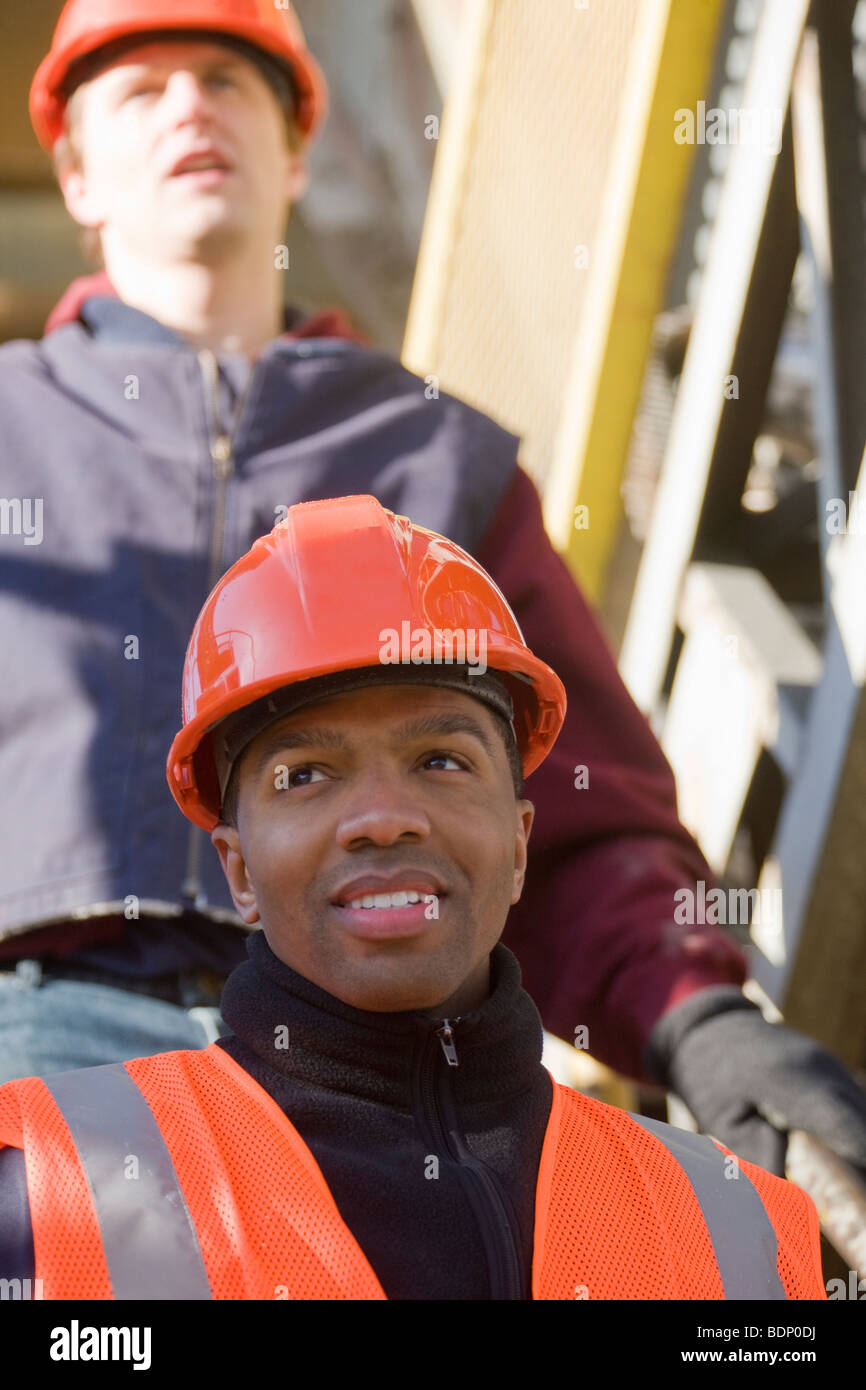 Two engineers on a conveyor belt at a construction site Stock Photo Alamy