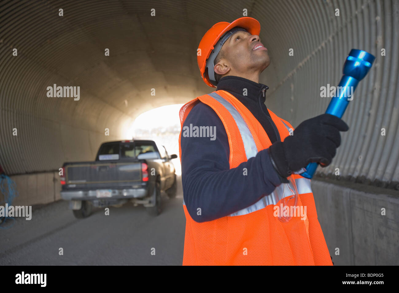 Engineer inspecting a tunnel Stock Photo