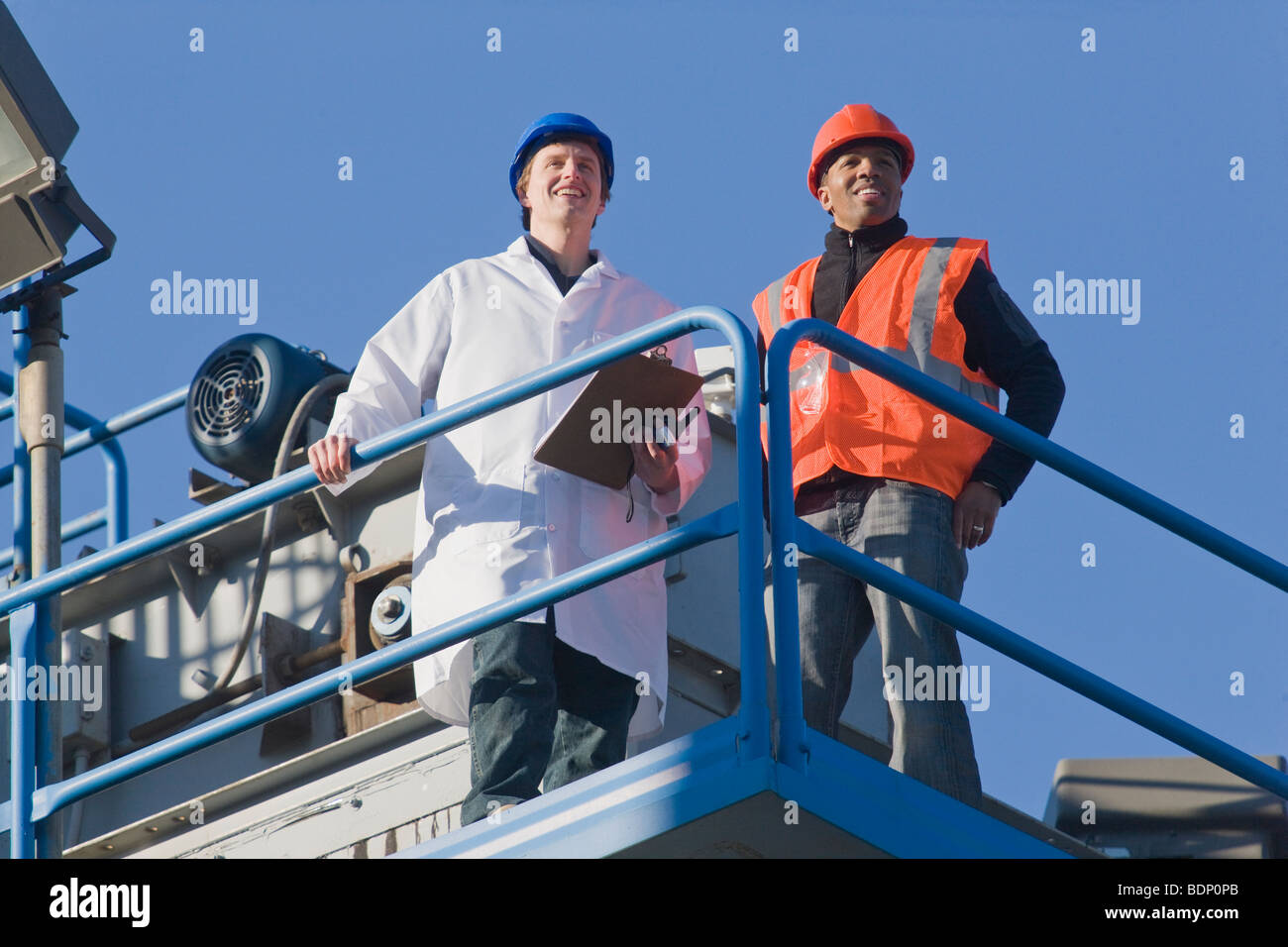 Lab worker standing with an engineer Stock Photo