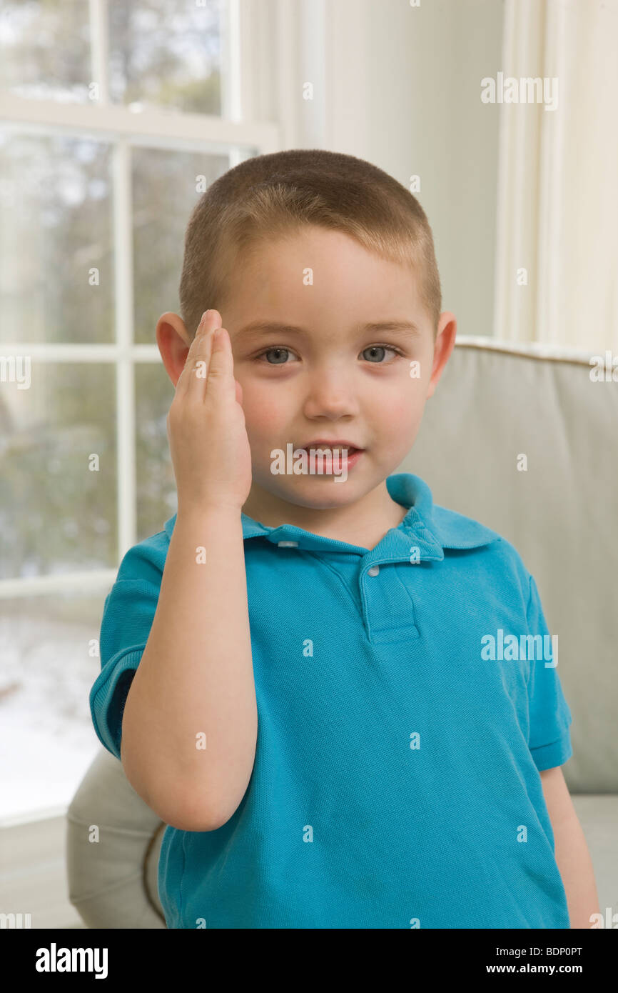 Boy signing the word 'Blue' in American Sign Language Stock Photo Alamy