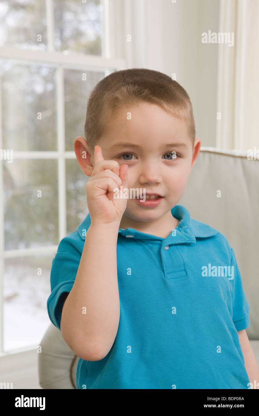 Boy signing the letter 'D' in American Sign Language Stock Photo Alamy