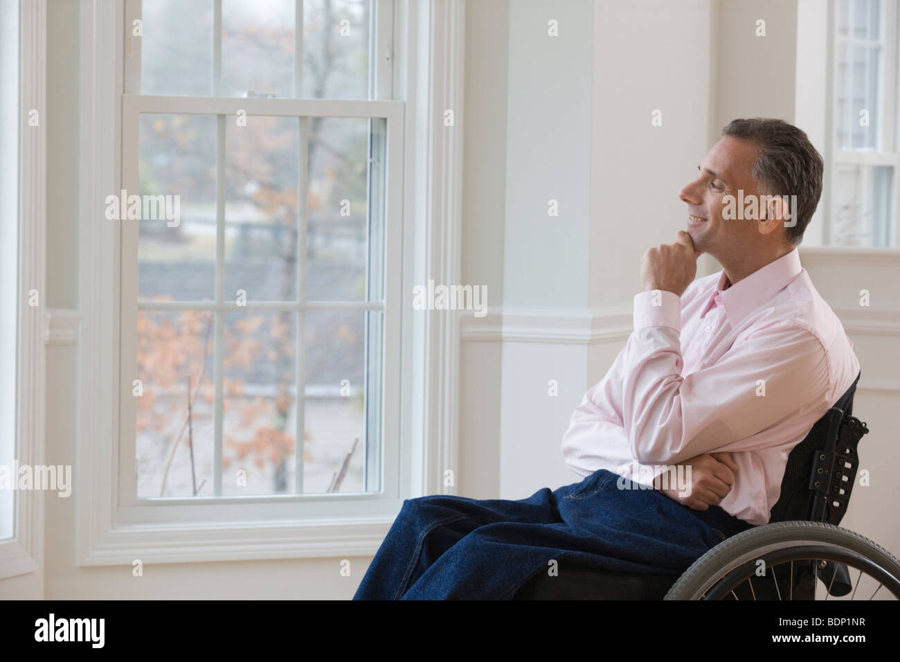 Businessman day dreaming on a wheelchair Stock Photo - Alamy