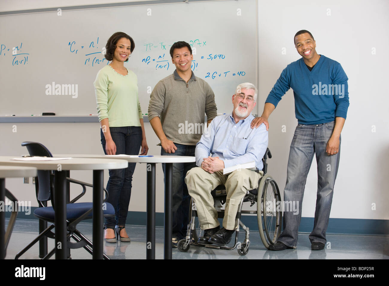 University professor with his students in a classroom Stock Photo