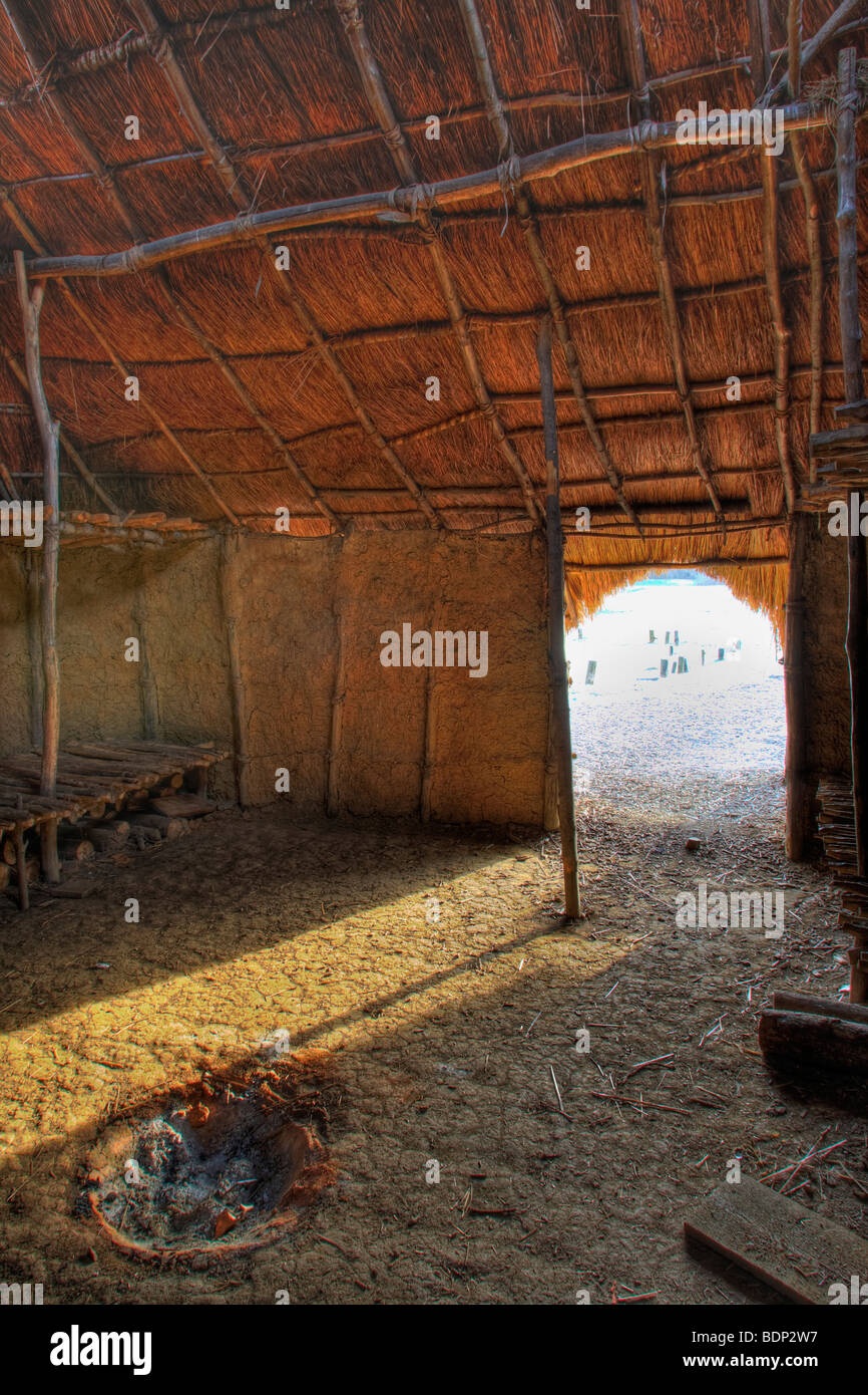 Sunlight shining through an open doorway in an old timber barn Stock