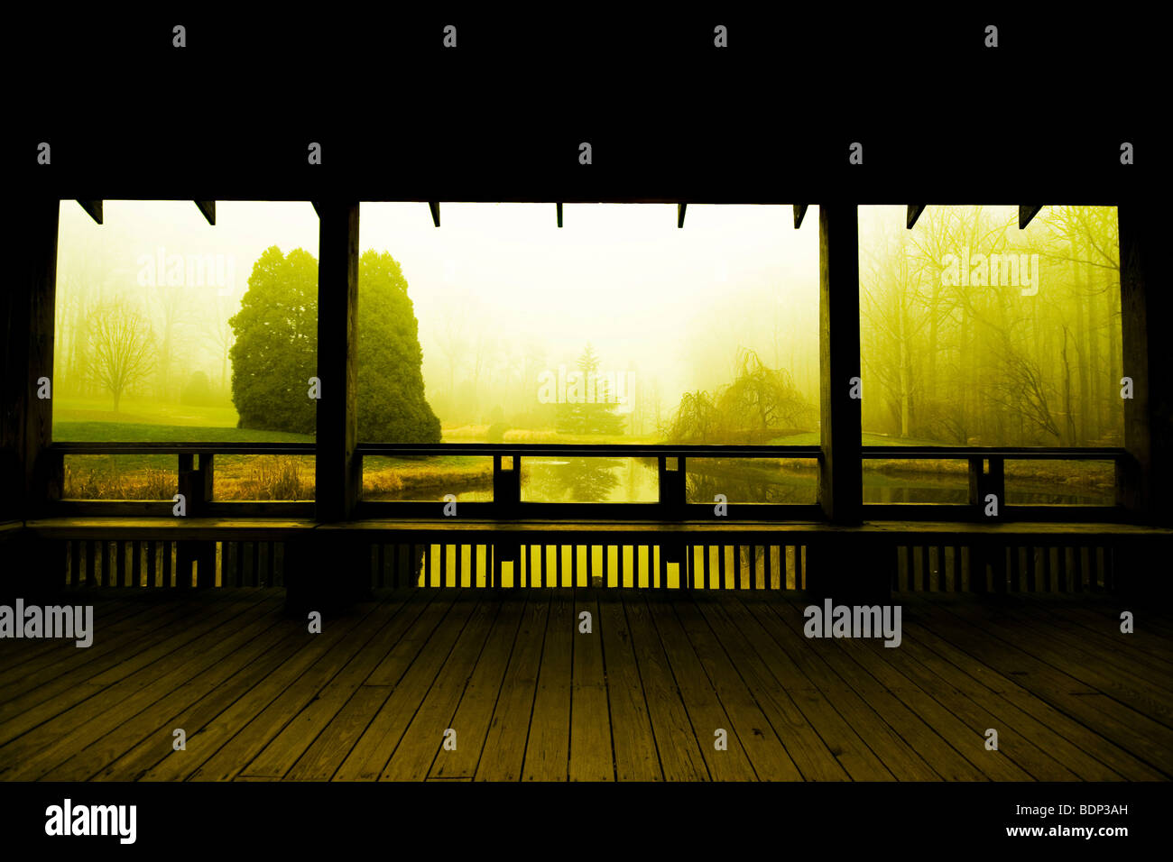 Wooden building overlooking an ornate garden with lake Stock Photo - Alamy