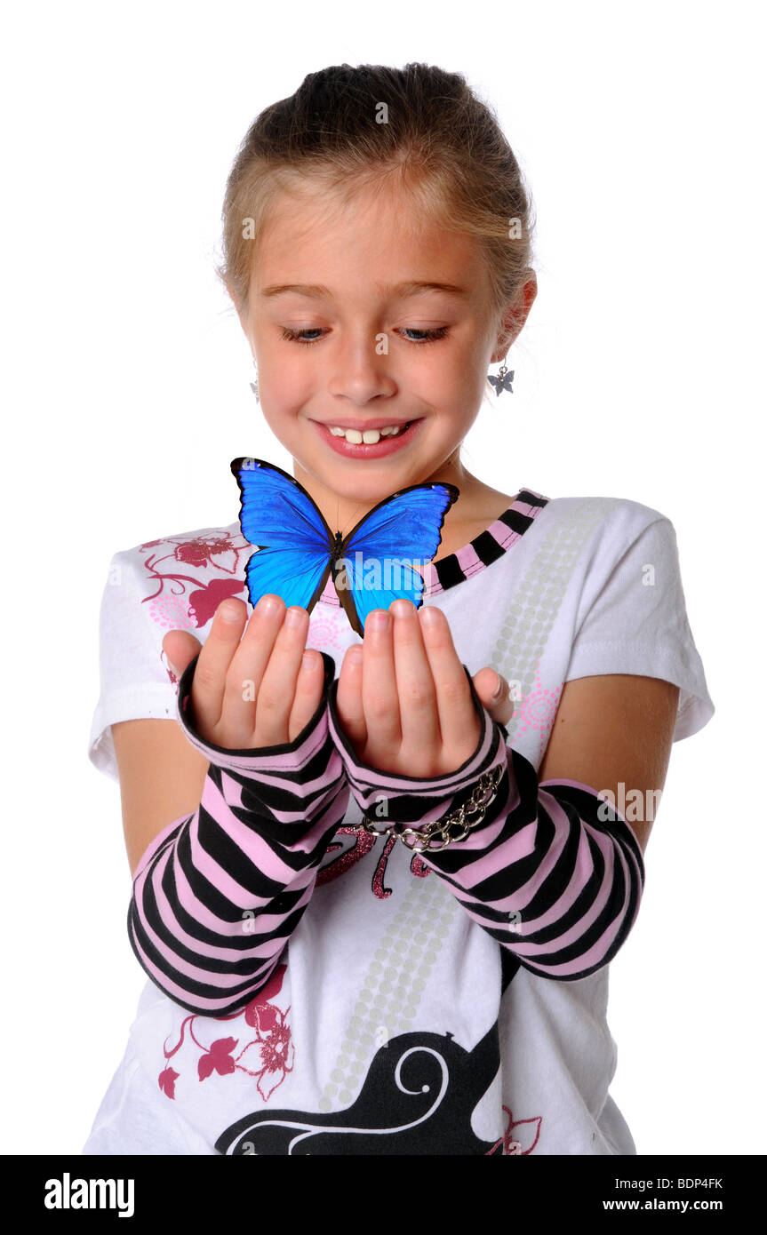Young Girl holding butterfly with her hands Stock Photo