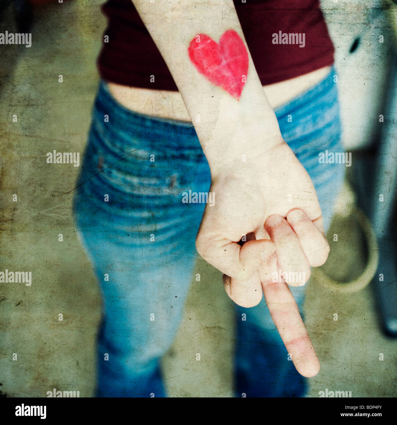 close-up of a woman's hand with a heart on her wrist Stock Photo