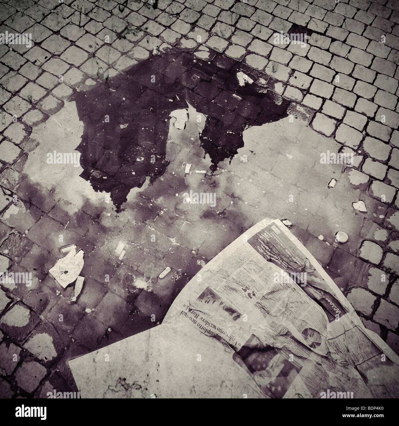 an old church reflected in a puddle with an old newspaper Stock Photo ...