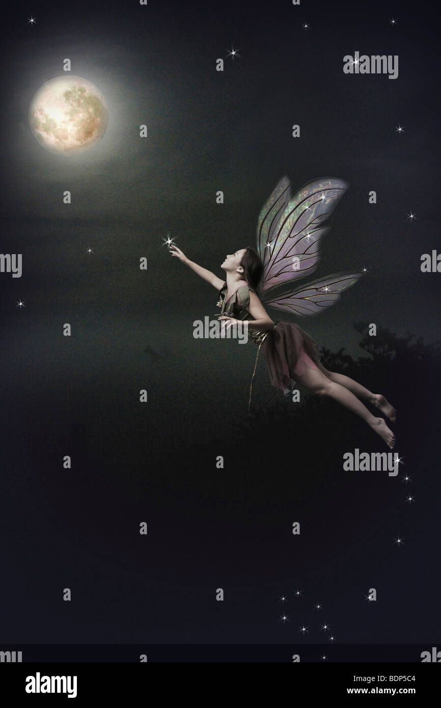 Fairy flying to the moon Stock Photo