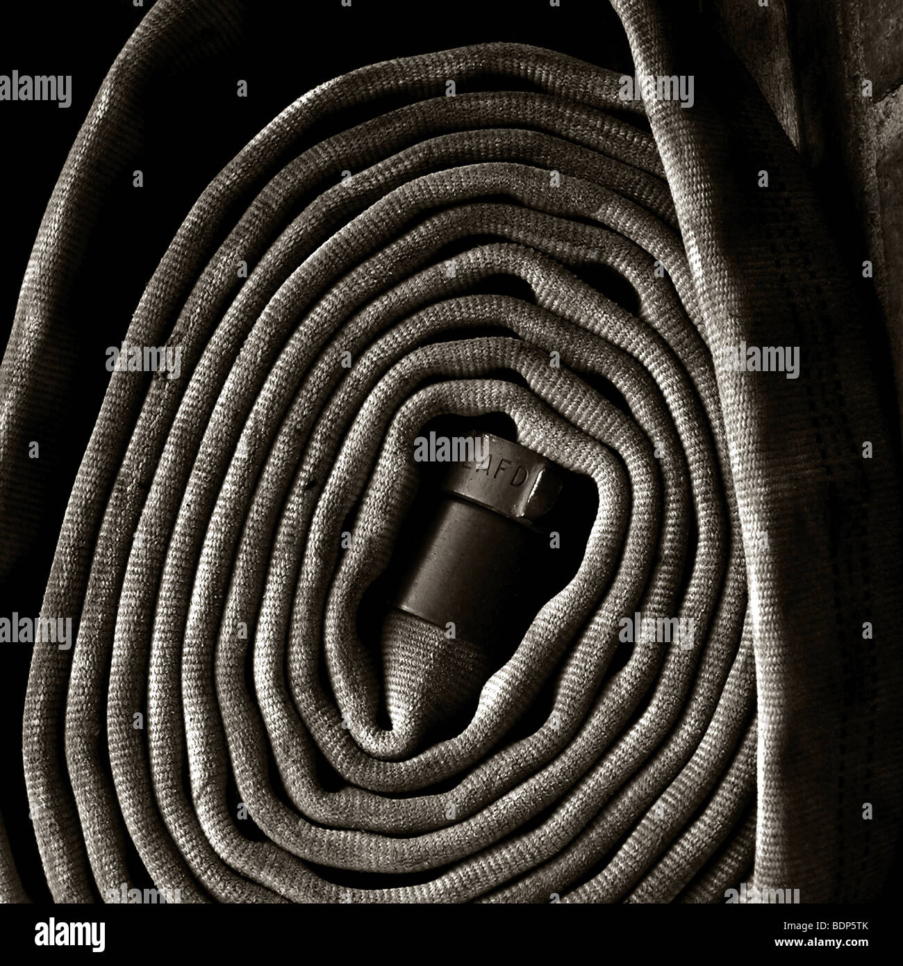 Rolled fire hose hi-res stock photography and images - Alamy