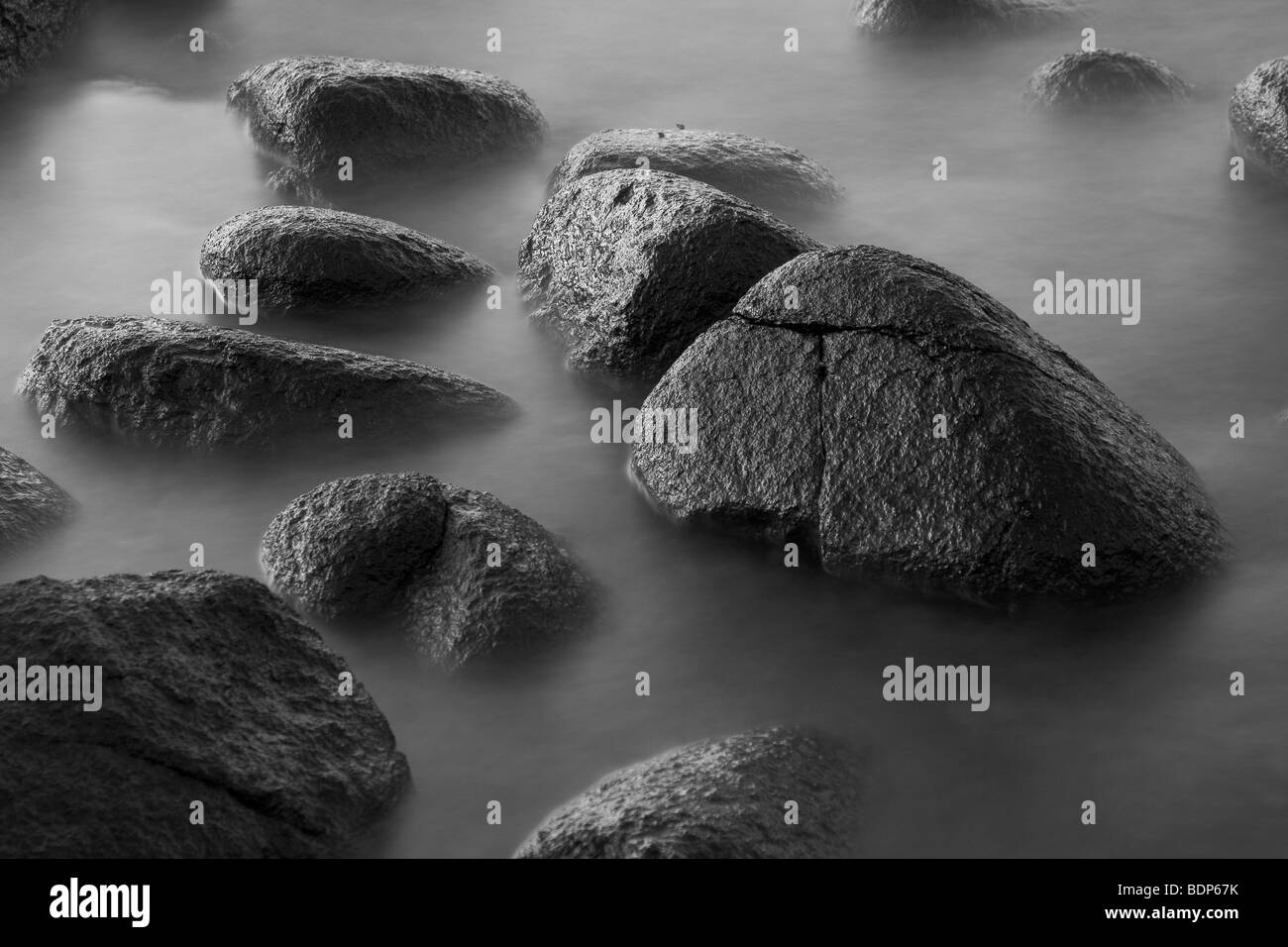 black stepping stones on the water Stock Photo