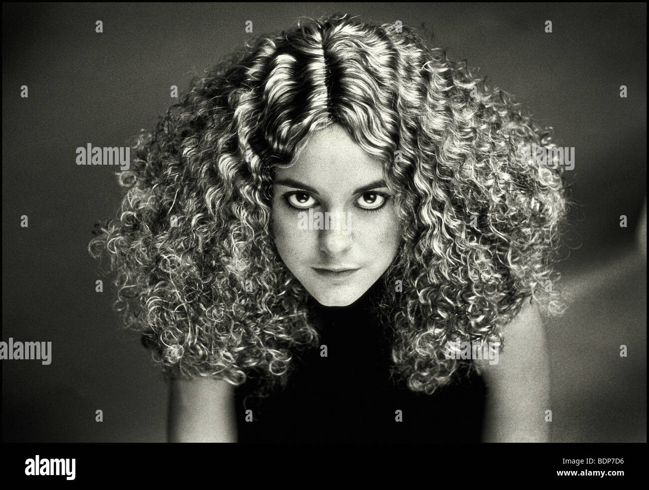 A young woman with curly hair Stock Photo - Alamy