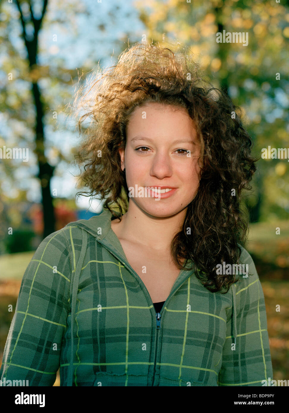 Portrait of a smiling teenage girl in the autumnal sun Sweden Stock ...