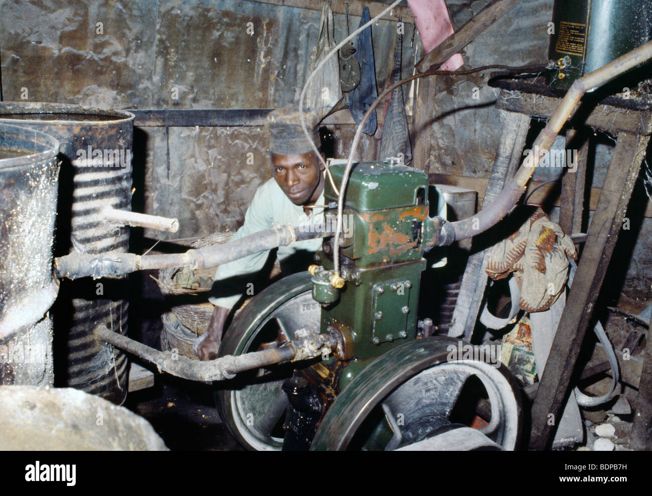 Nigeria Man Turning On Motor on Grinding Machine for Maize & Cassava