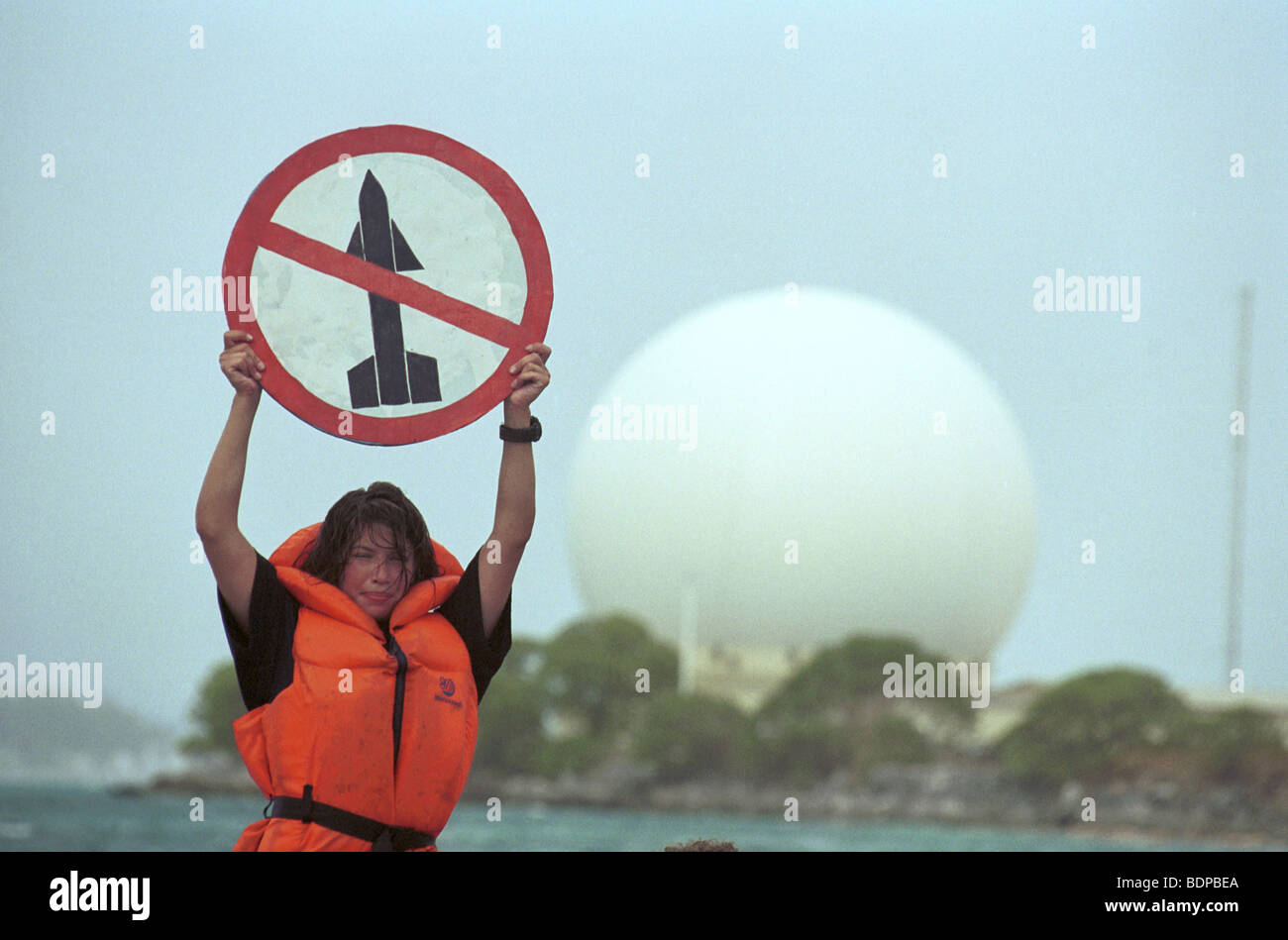 Anti US Star Wars protest at Kwajelein Atoll, North Pacific with the large Radar dome used to track missiles in background Stock Photo